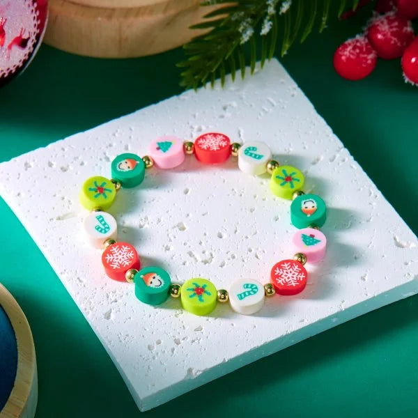 Kerst armband met kerstman sneeuwpop ster en kerstboom hanger