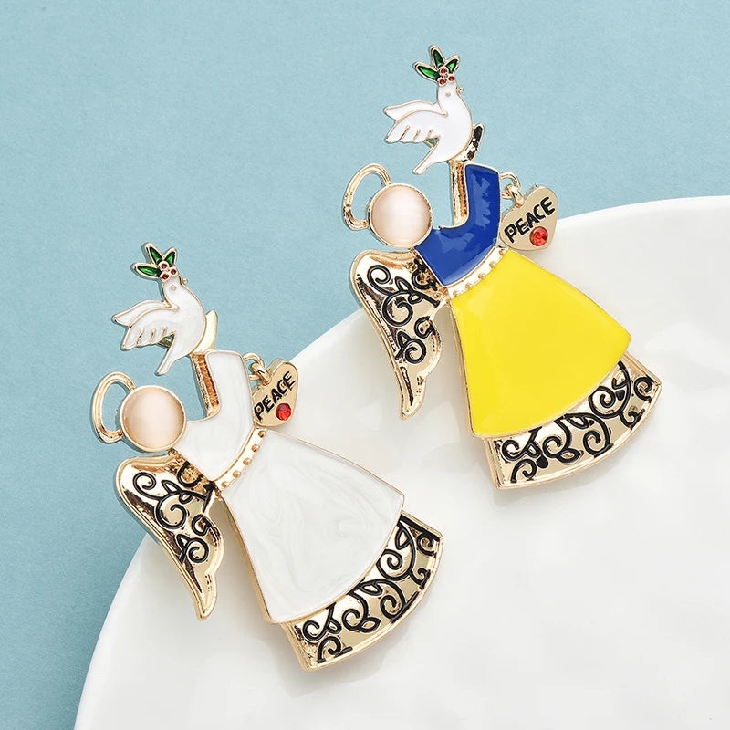Broche Kerst | Vredesduif en Engel broche met feestelijke uitstraling