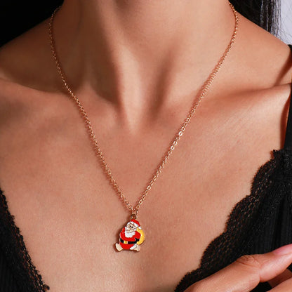 Kerst ketting met kerstboom, kerstman en belletjes hanger – feestelijke sieraden voor dames