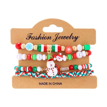 Kerst armband met kerstman sneeuwpop ster en kerstboom hanger