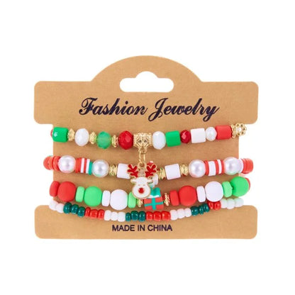 Kerst armband met kerstman sneeuwpop ster en kerstboom hanger