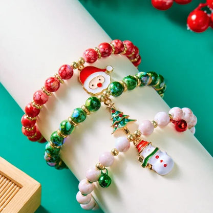 Kerst armband met kerstman sneeuwpop ster en kerstboom hanger