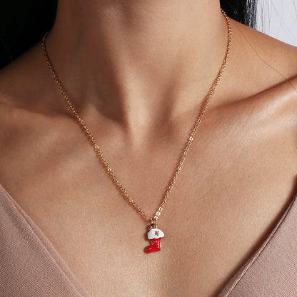 Kerst ketting met kerstboom, kerstman en belletjes hanger – feestelijke sieraden voor dames