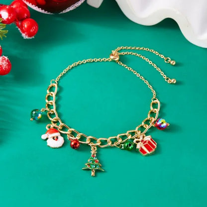 Kerst armband met kerstman sneeuwpop ster en kerstboom hanger