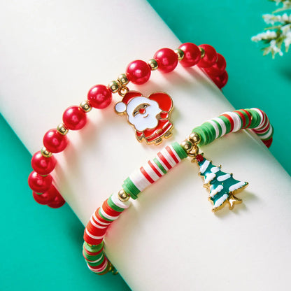 Kerst armband met kerstman sneeuwpop ster en kerstboom hanger