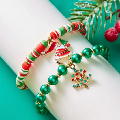 Kerst armband met kerstman sneeuwpop ster en kerstboom hanger