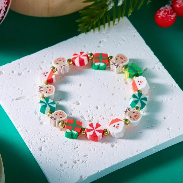 Kerst armband met kerstman sneeuwpop ster en kerstboom hanger