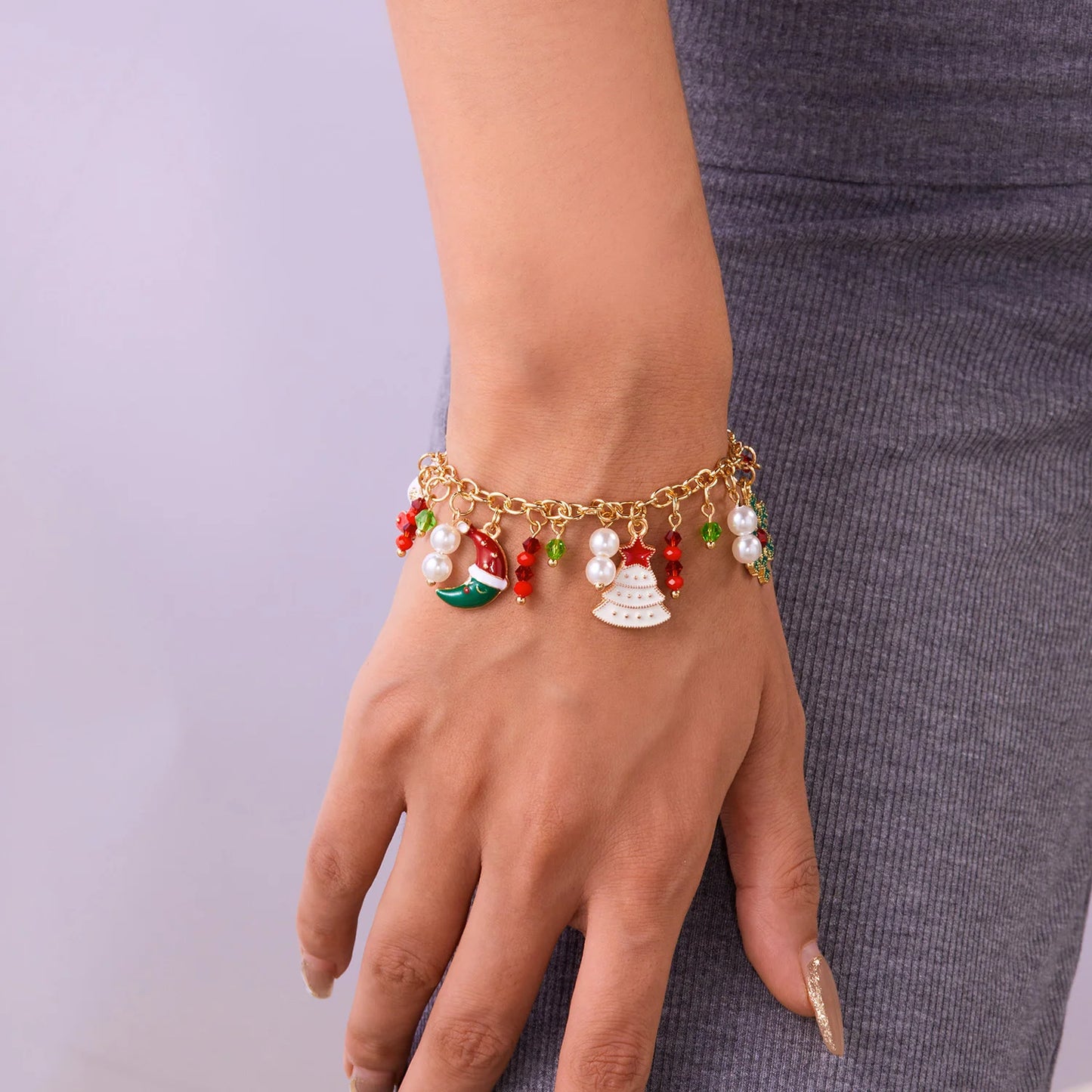 Kerst armband met kerstman sneeuwpop ster en kerstboom hanger