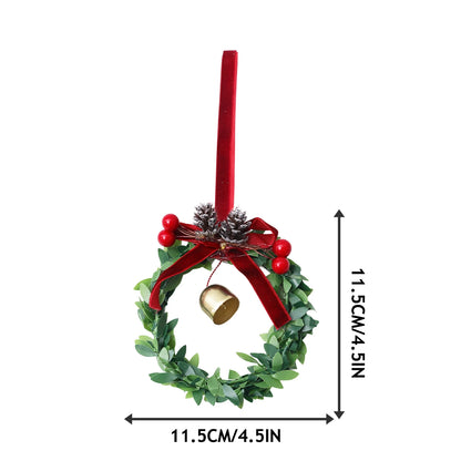 Kerst krans met bel, kunstgroen en fluwelen strik voor deur of haard