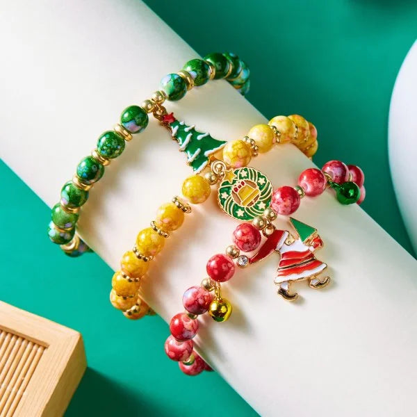 Kerst armband met kerstman sneeuwpop ster en kerstboom hanger