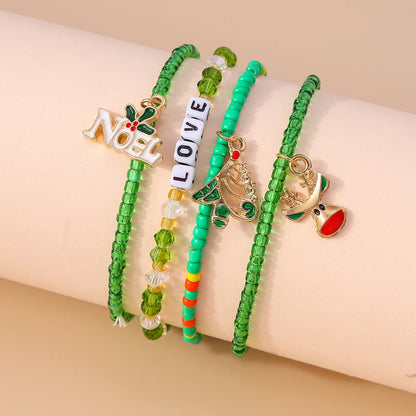 Kerst armbanden set met Kerstman, rendier en sneeuwpop bedels
