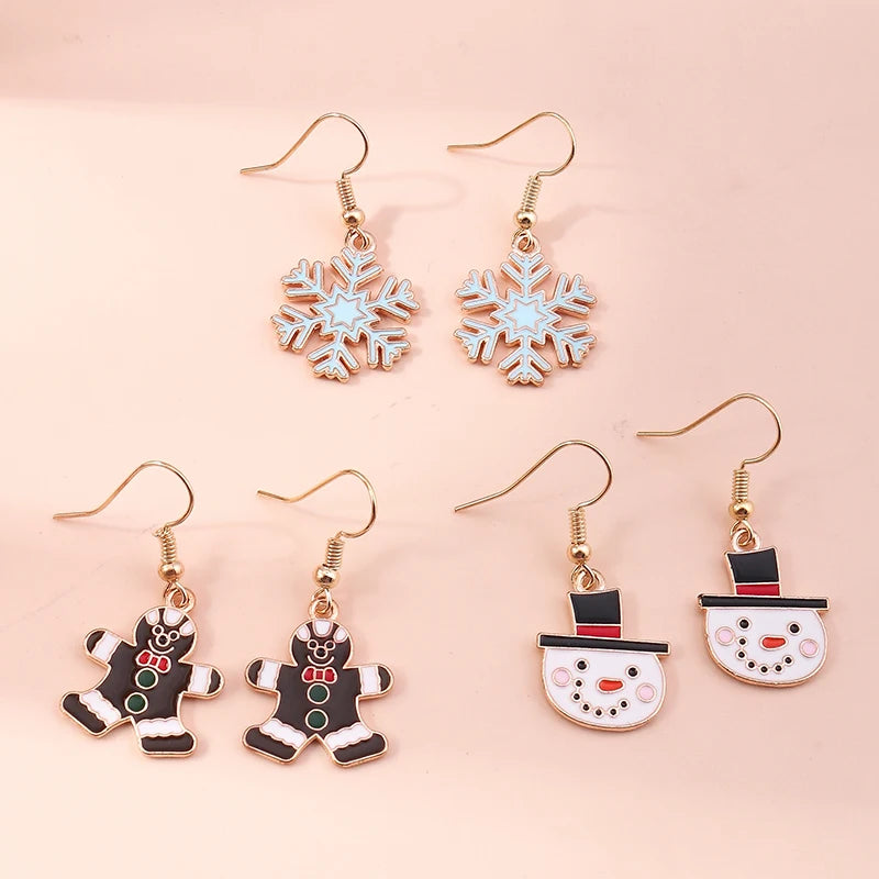 Kerst oorbellen set met kerstman, rendier, ster, bel en sneeuwpop