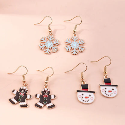 Kerst oorbellen set met kerstman, rendier, ster, bel en sneeuwpop