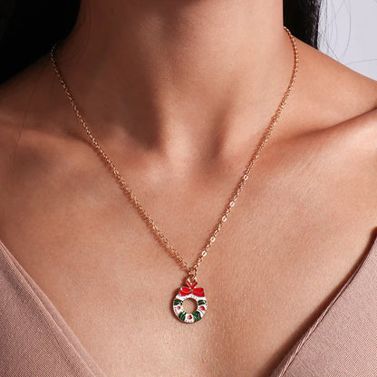 Kerst ketting met kerstboom, kerstman en belletjes hanger – feestelijke sieraden voor dames