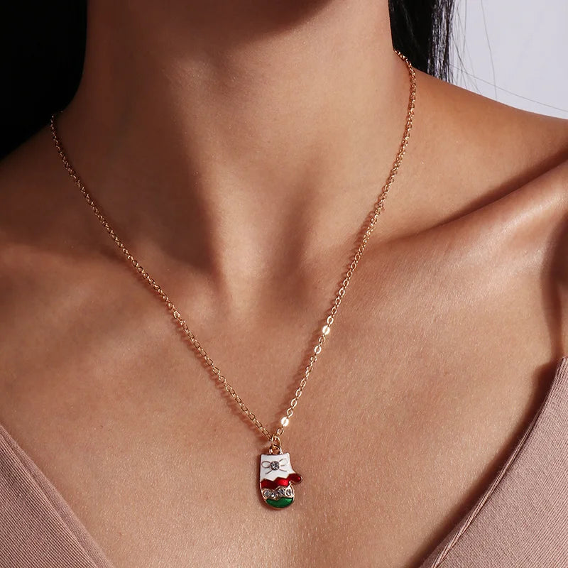 Kerst ketting met kerstboom, kerstman en belletjes hanger – feestelijke sieraden voor dames