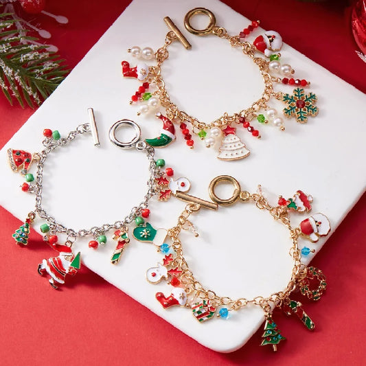 Kerst armband met kerstman sneeuwpop ster en kerstboom hanger