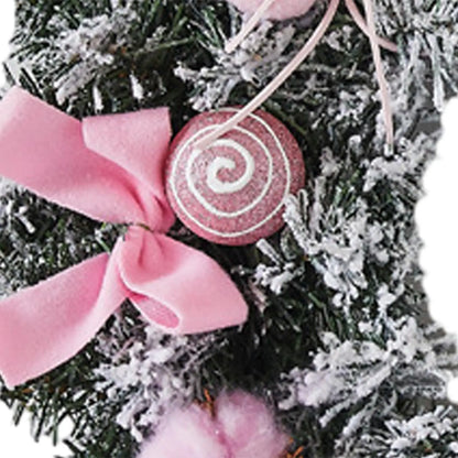 Kerst krans met roze strik – stijlvolle winterdecoratie voor deur en muur