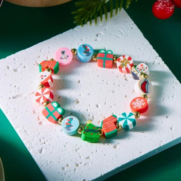 Kerst armband met kerstman sneeuwpop ster en kerstboom hanger