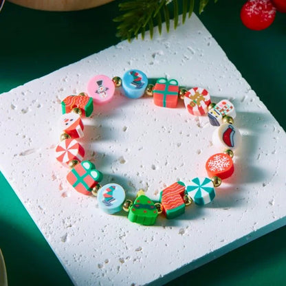 Kerst armband met kerstman sneeuwpop ster en kerstboom hanger