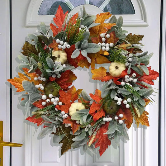 Kerst krans met pompoen bessen en herfstbladeren voor deurdecoratie