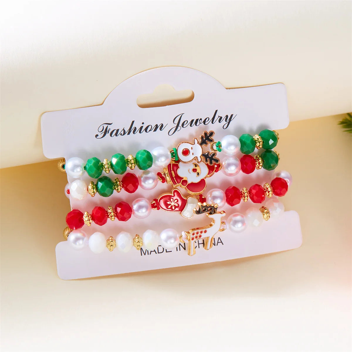 Kerst armband set met kerstboom rendier en kerstman kralen (4 stuks)